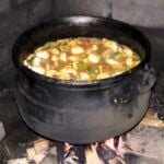 Lobster Potjiekos close up in black pot